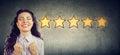 ÃÂ¡heerful beautiful woman smiling celebrating five stars rating for service provided